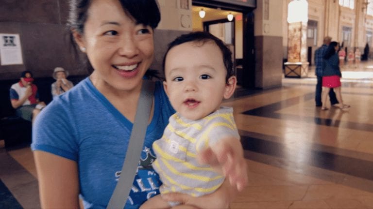 smiling mom holding baby