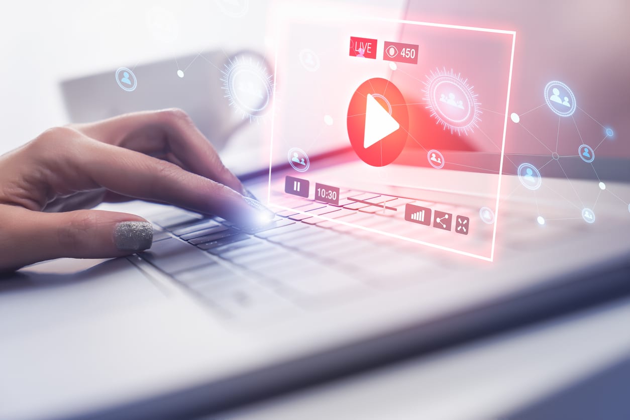 image of woman typing on keyboard with holographic brand narrative video hovering over the keyboard 