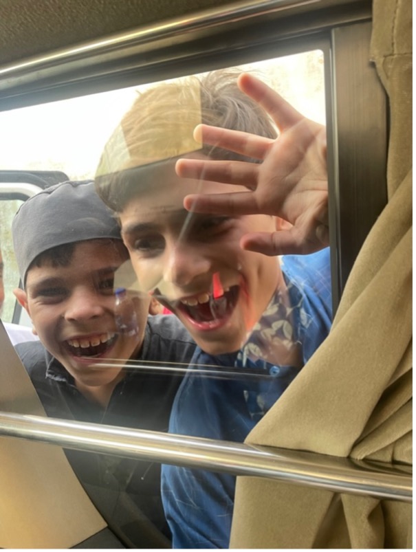 Kids clamoring to see us inside our van
