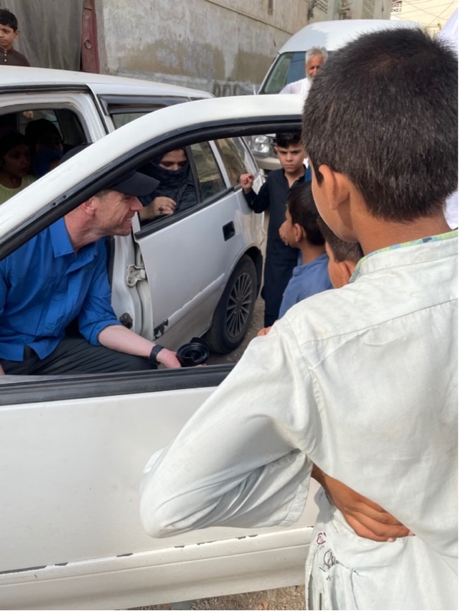 Kevin making friends with the local kids